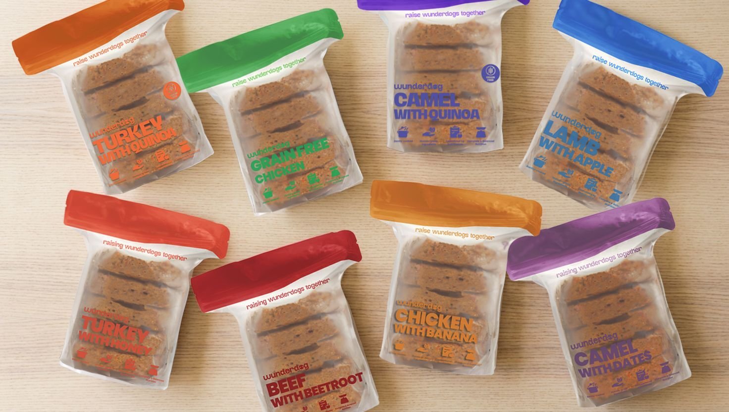 Selection of Wunderdog meal packs with different recipe labels arranged on a light surface.